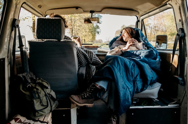 Couple having a nice road trip in a van