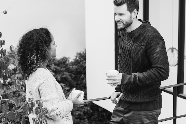 Couple having take away coffee