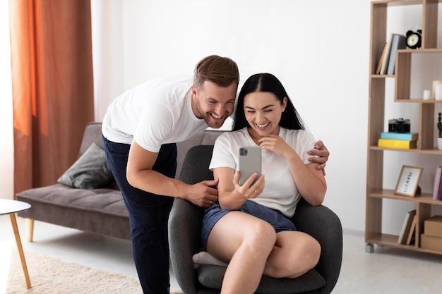 Couple having a video call with their family