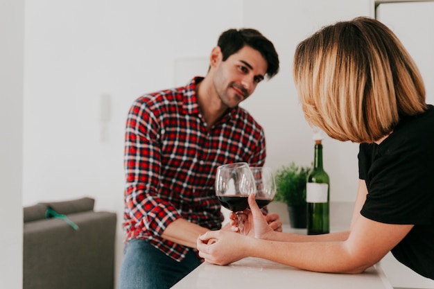 Couple having wine at home