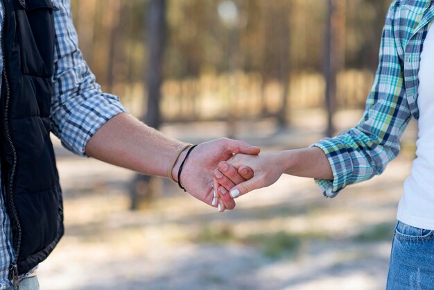 Couple holding hands front view