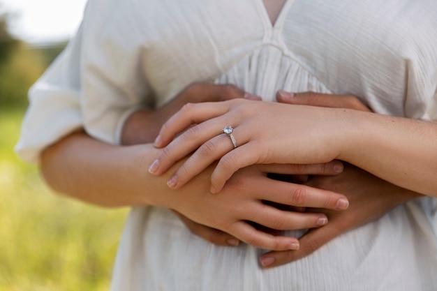 Free photo couple holding hands front view