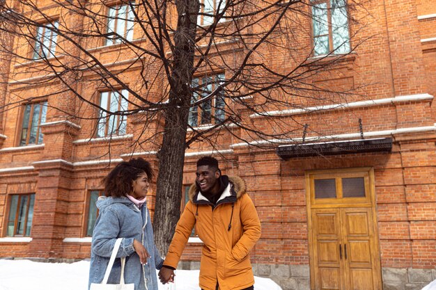 Couple holding hands medium shot