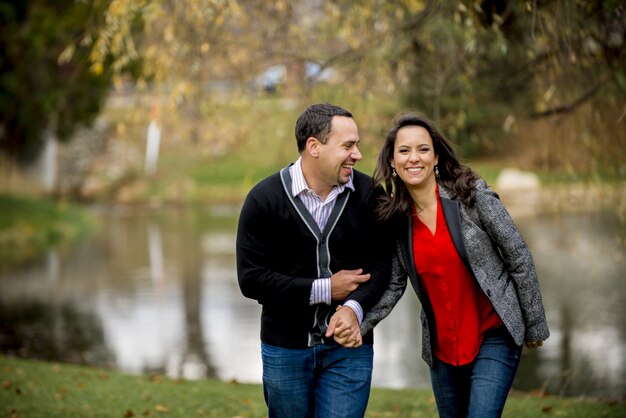 Couple holding hands while laughing