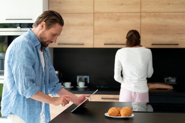 Couple at home doing house chores