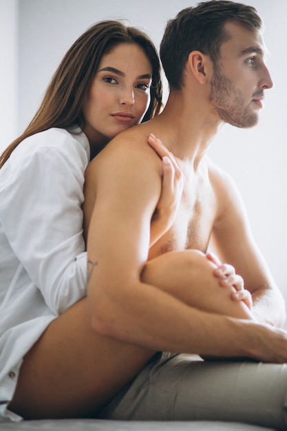 Couple at home embracing