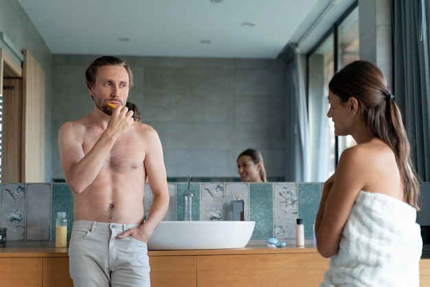 Free photo couple at home getting ready for the day