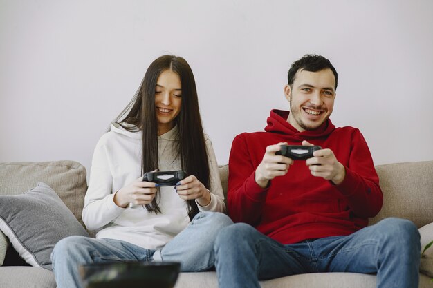 Couple at home playing video games