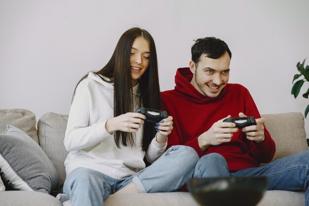 Couple at home playing video games