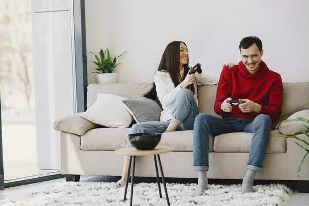 Couple at home playing video games