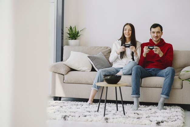 Couple at home playing video games