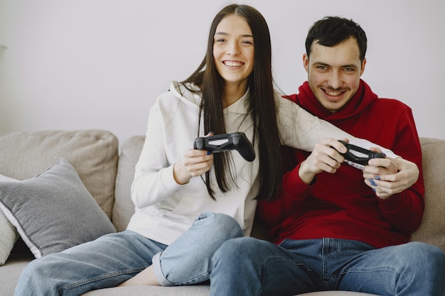 Couple at home playing video games