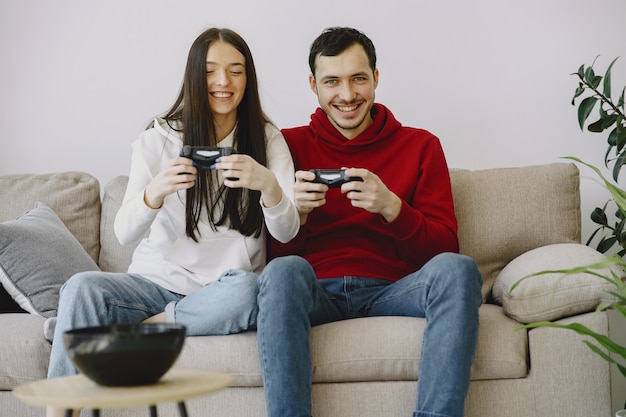 Couple at home playing video games