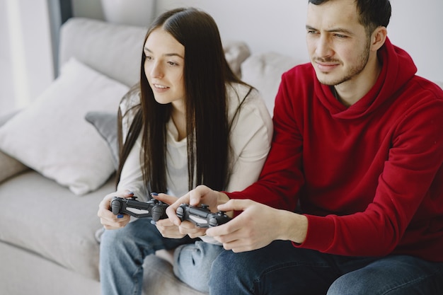 Couple at home playing video games