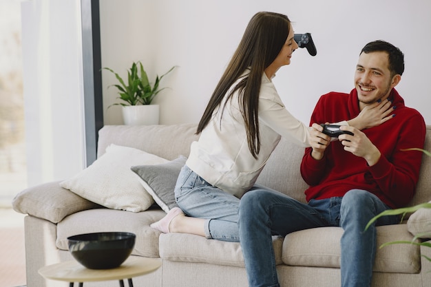 Couple at home playing video games