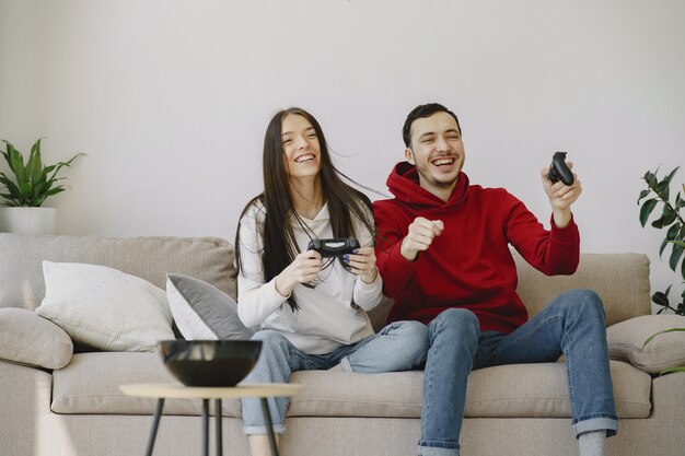 Couple at home playing video games