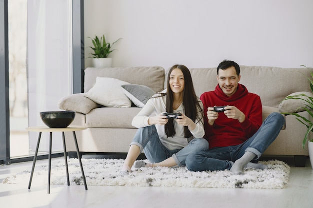 Couple at home playing video games