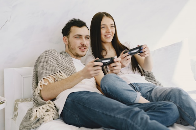 Couple at home playing video games