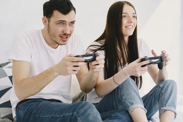 Couple at home playing video games