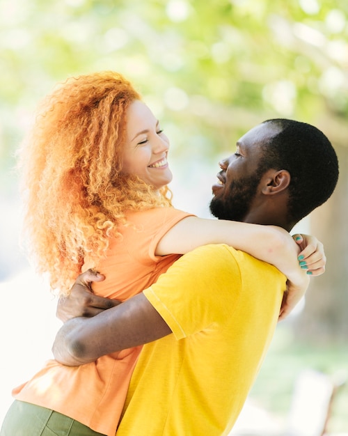 Couple hugging each other in the park