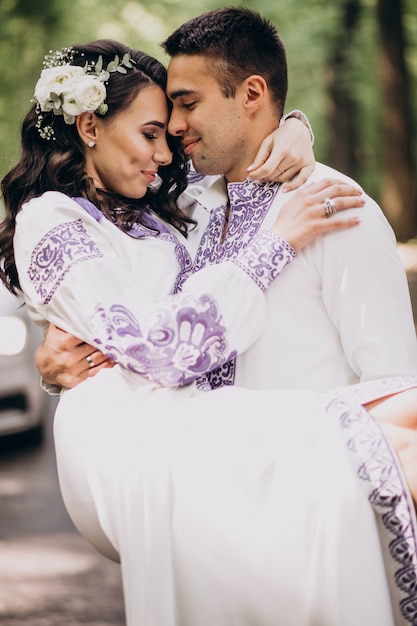 Free photo couple hugging in the forest