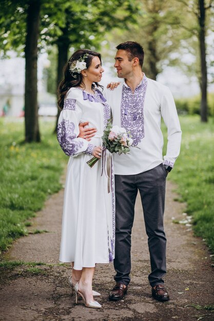 couple hugging in the forest