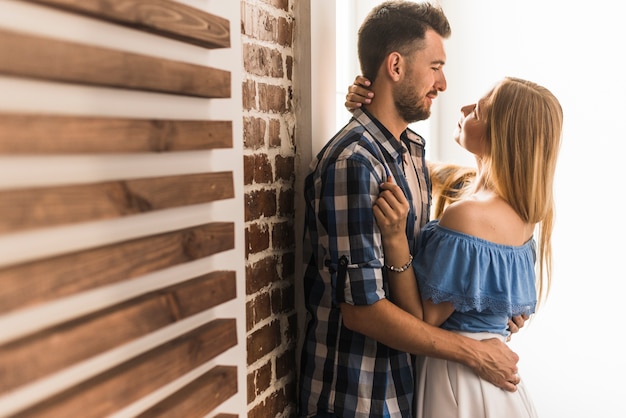 Couple hugging and looking at each other