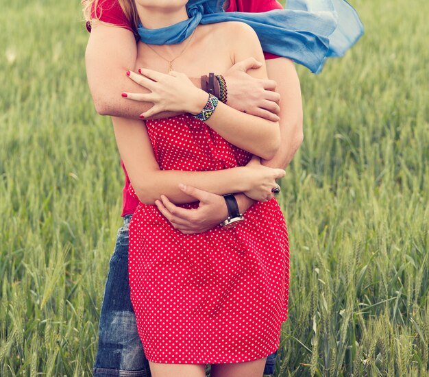 Couple hugging in a meadow