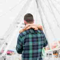 Free photo couple hugging outdoors