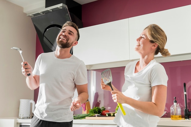 Couple indoors dancing in the kitchen