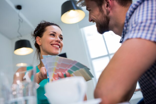 Couple interacting over color swatch