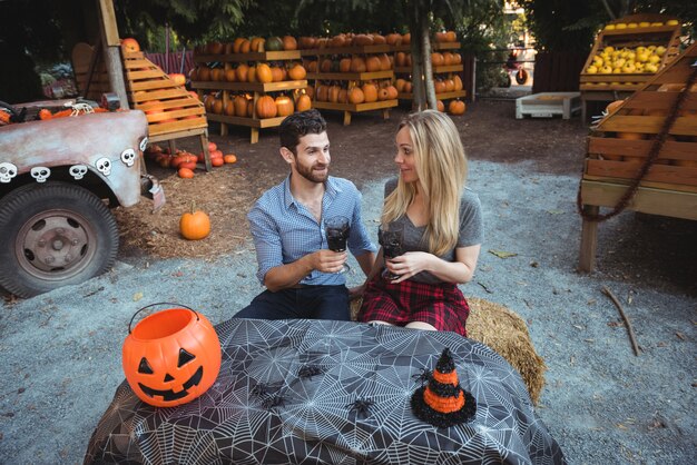 Couple interacting while having a glass of wine