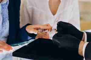 Free photo couple at jewelry store choosing a ring together