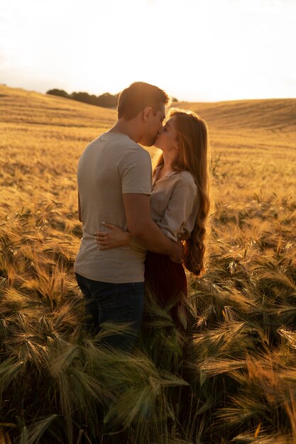 Couple kissing in nature side view