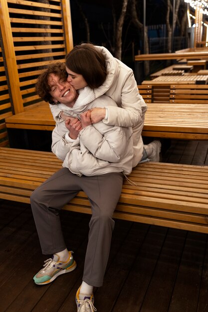 Couple kissing outdoors while embracing