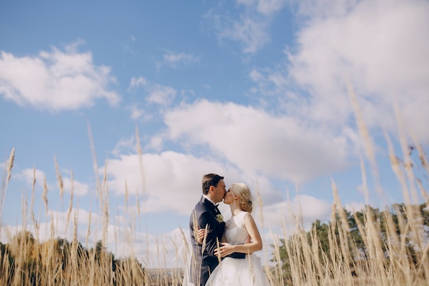 Couple kissing in sky background