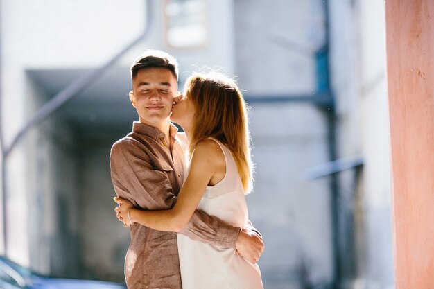 Couple kissing in street