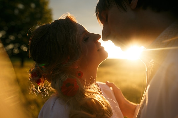 Couple kissing on the sunset