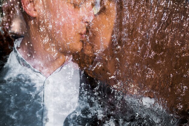 Couple kissing underwater