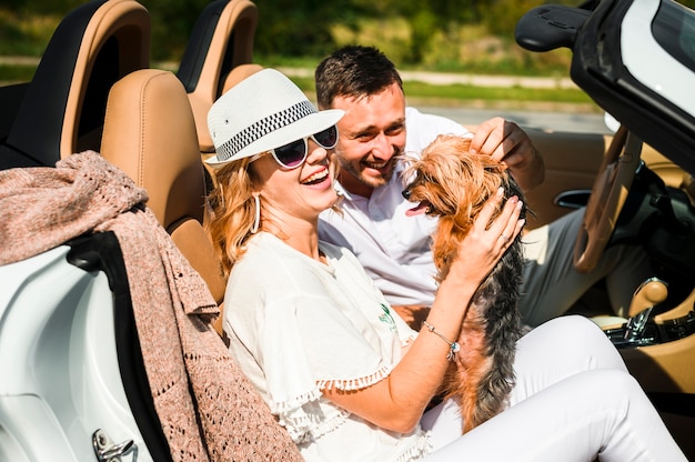 Free photo couple laughing at dog