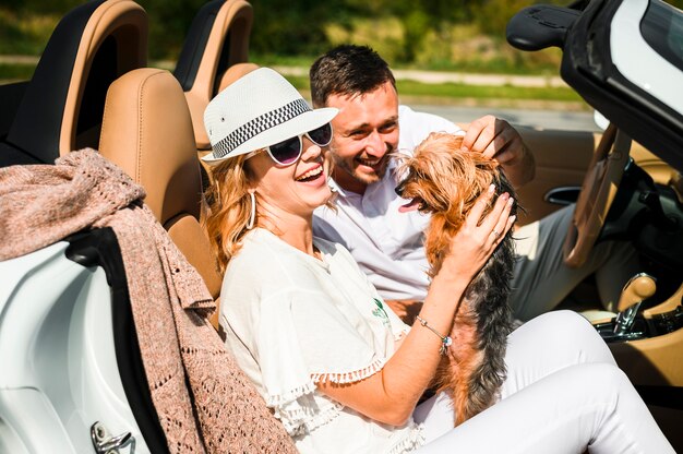 Couple laughing at dog