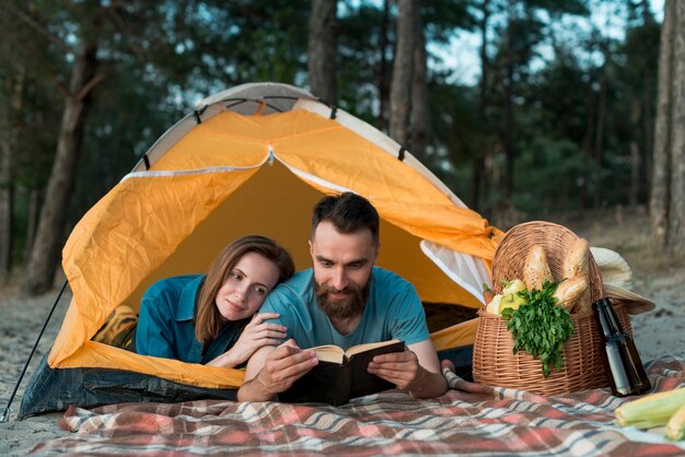 Couple laying down and reading