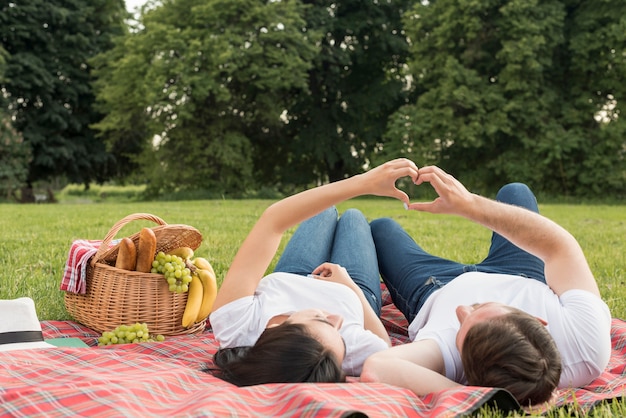 Couple laying on a picnic blanket