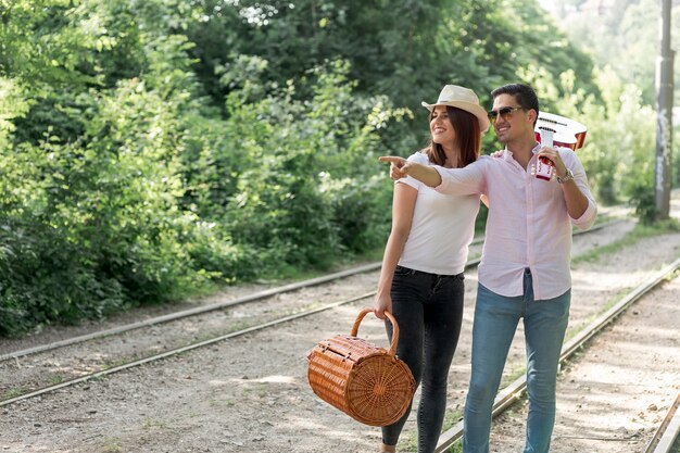 Couple looking away on the railroad