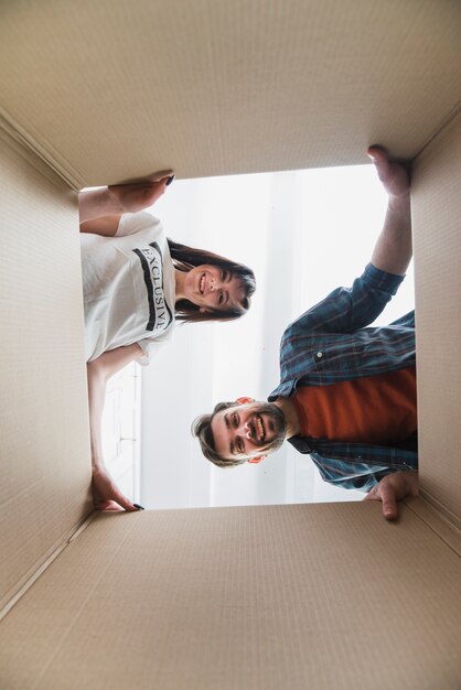 Couple looking inside box