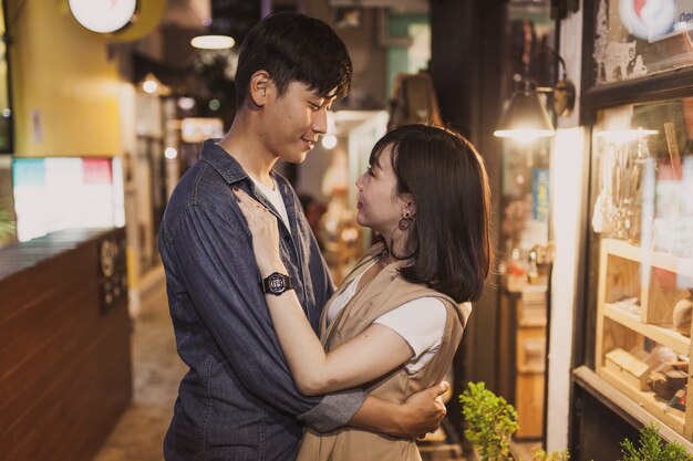 Couple looking into each other's eyes while hugging