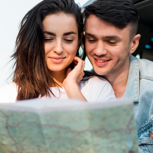 Couple looking on a map together close-up