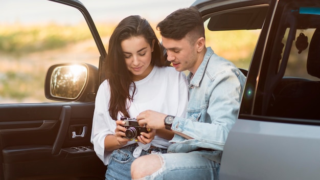 Couple looking at photos on a road trip
