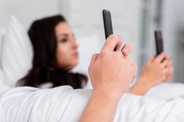 Couple looking on social media close-up