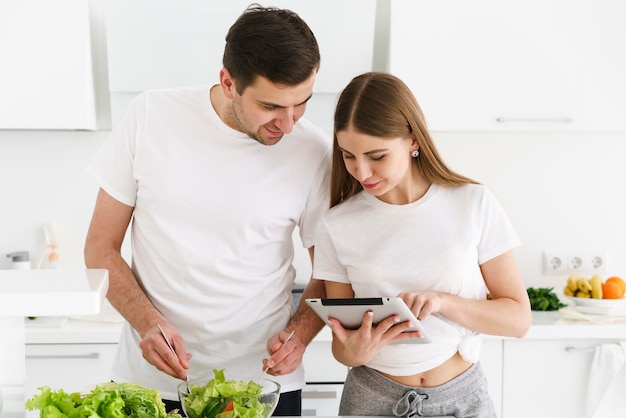 Couple looking on tablet